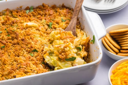angled shot of wooden spoon in cabbage casserole