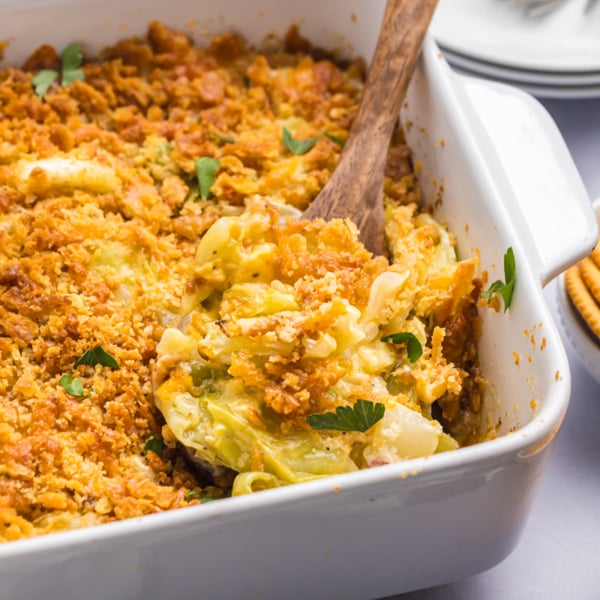 angled shot of wooden spoon in cabbage casserole