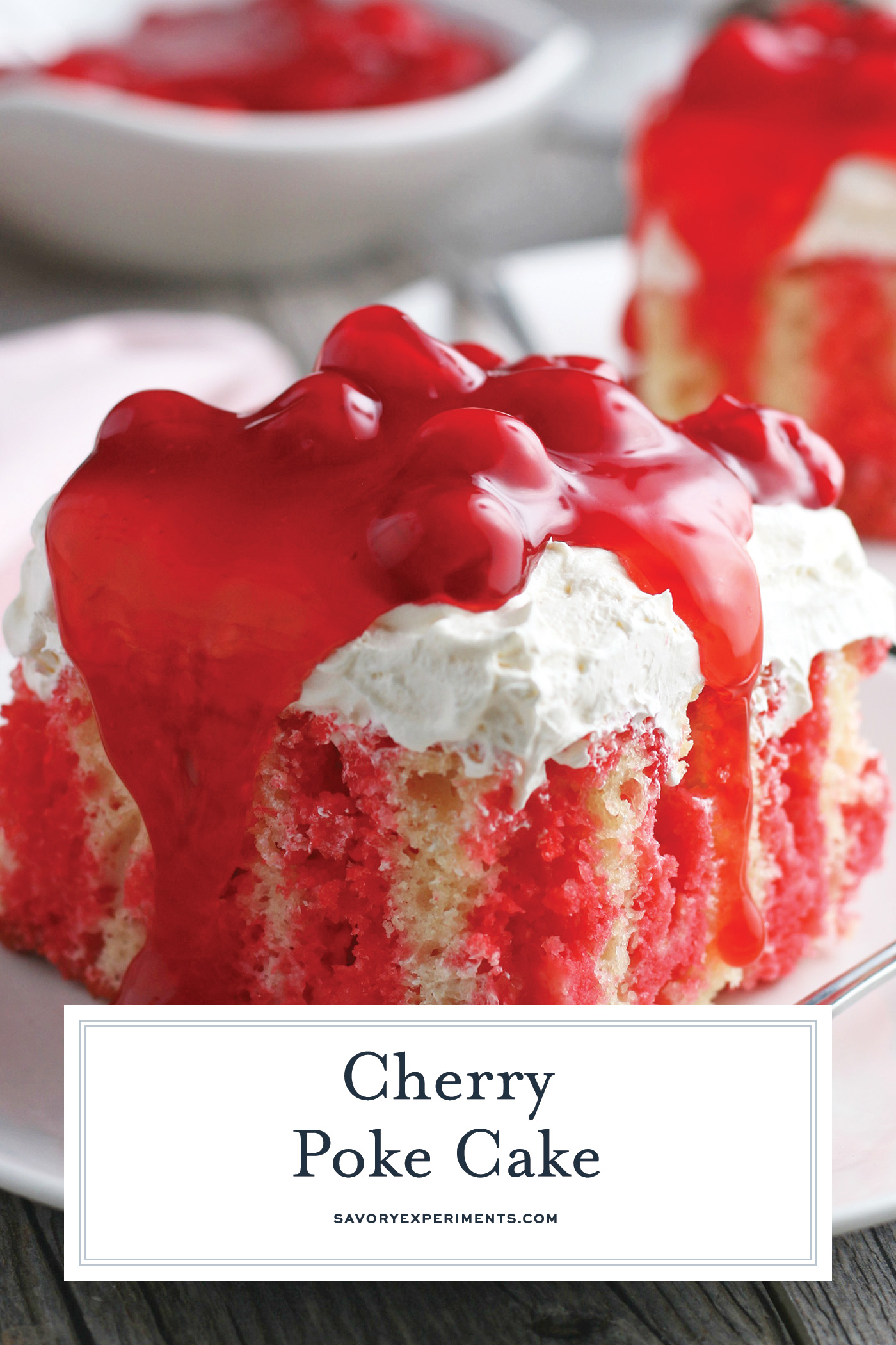 angled shot of slice of cherry poke cake with text overlay