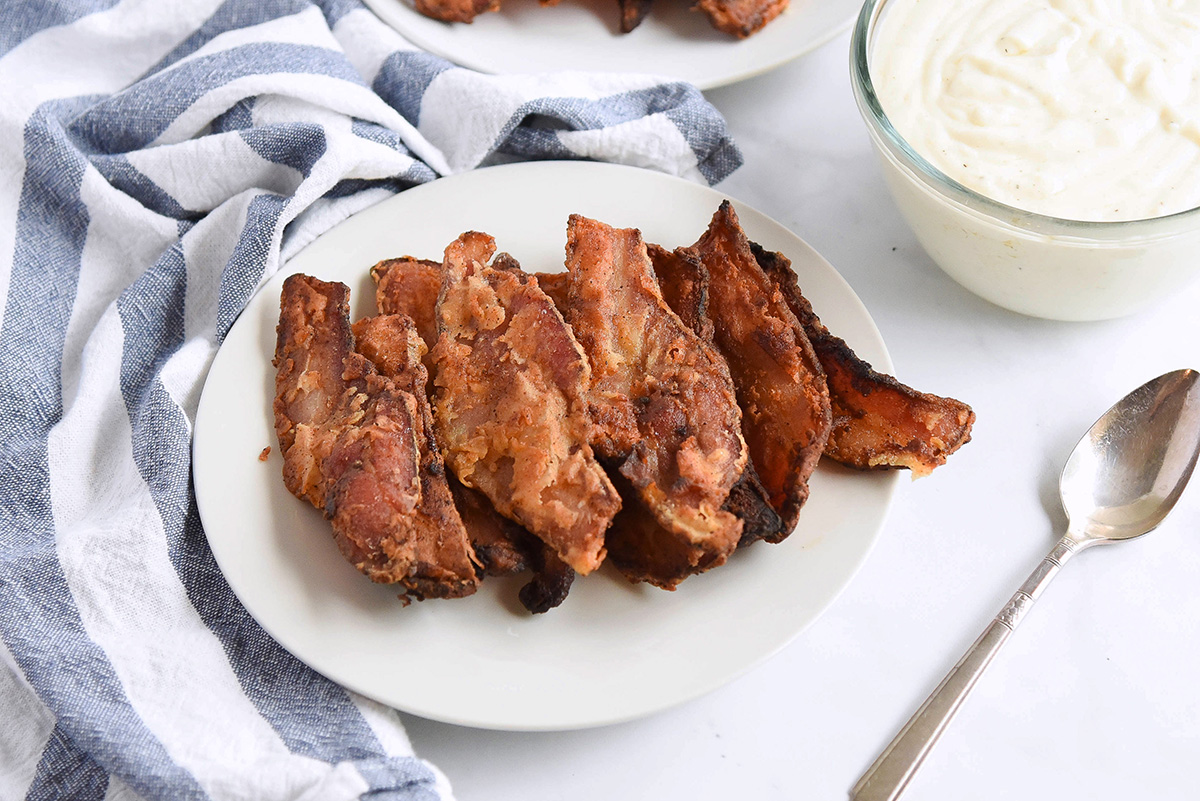 angled shot of plate of chicken fried bacon