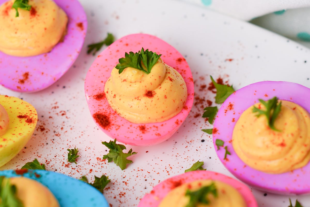 close up angled shot of dyed deviled eggs
