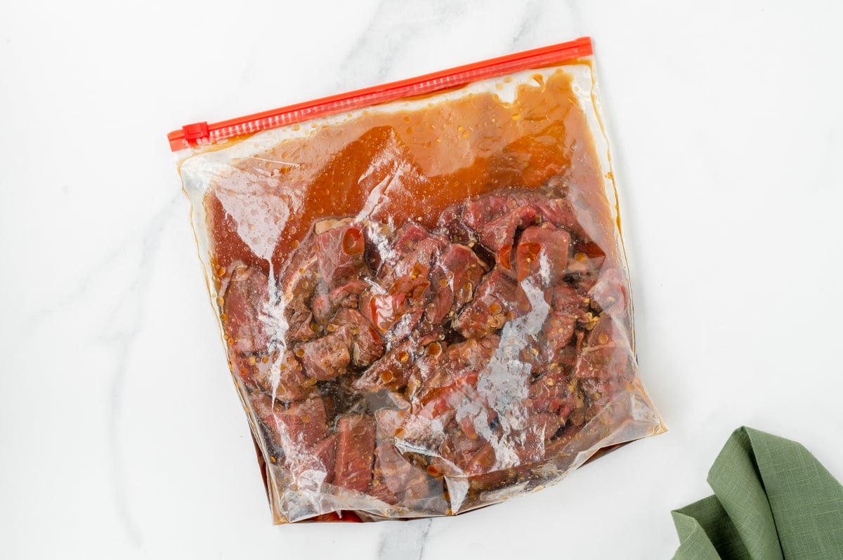 overhead shot of bulgogi beef marinating in ziplock bag