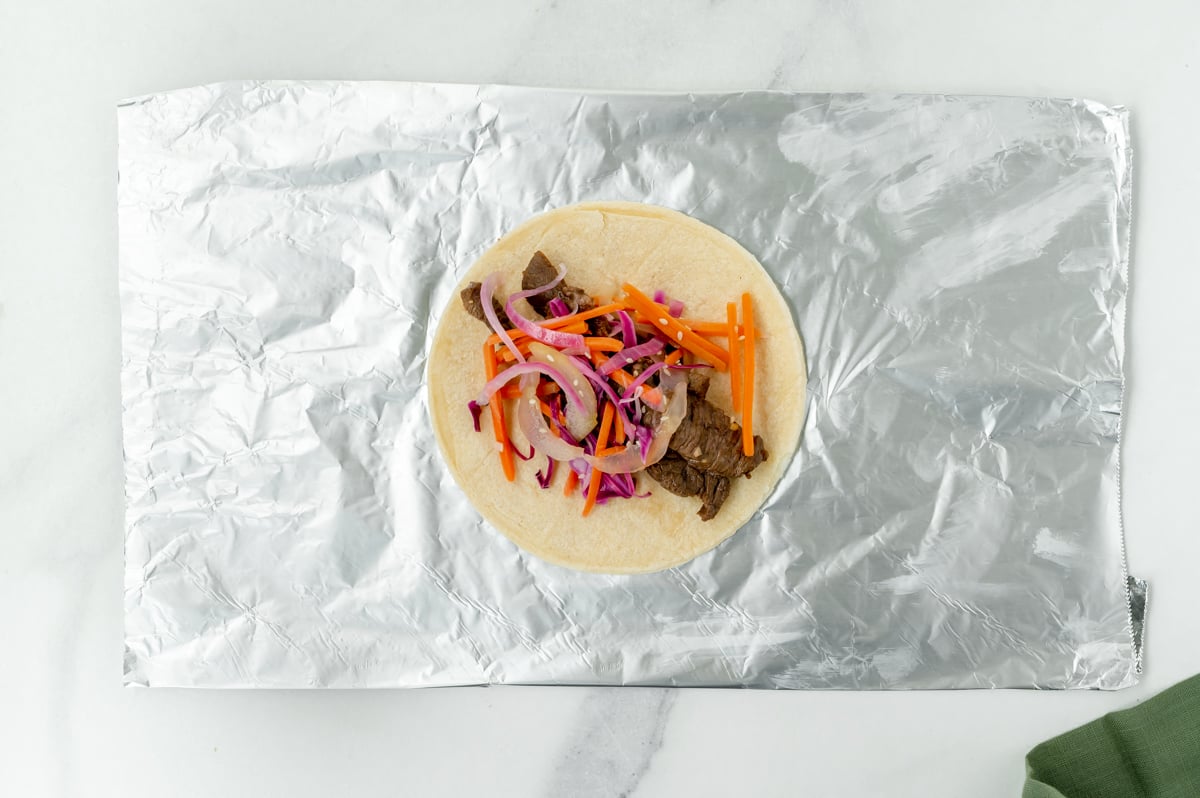 overhead shot of beef taco on piece of foil