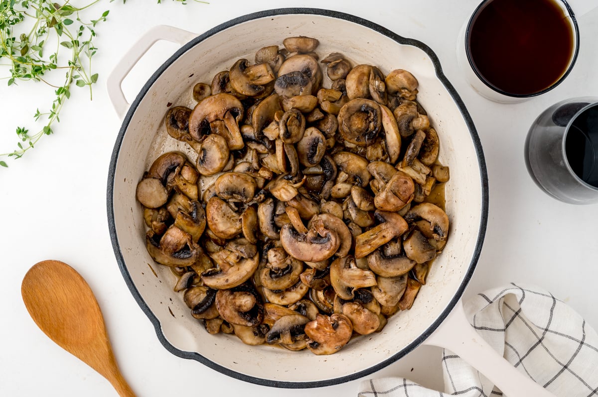 overhead shot of mushrooms cooking in pan