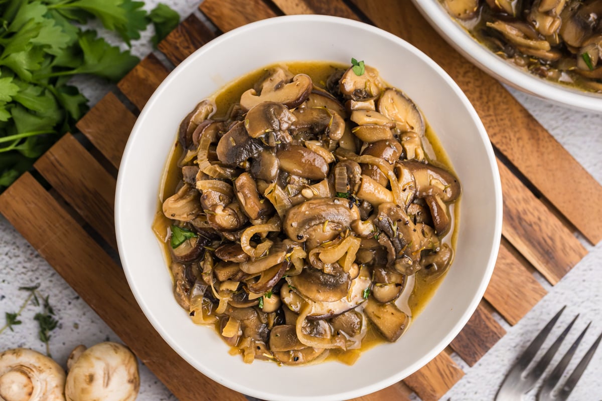 close up overhead shot of sauteed mushrooms in bowl
