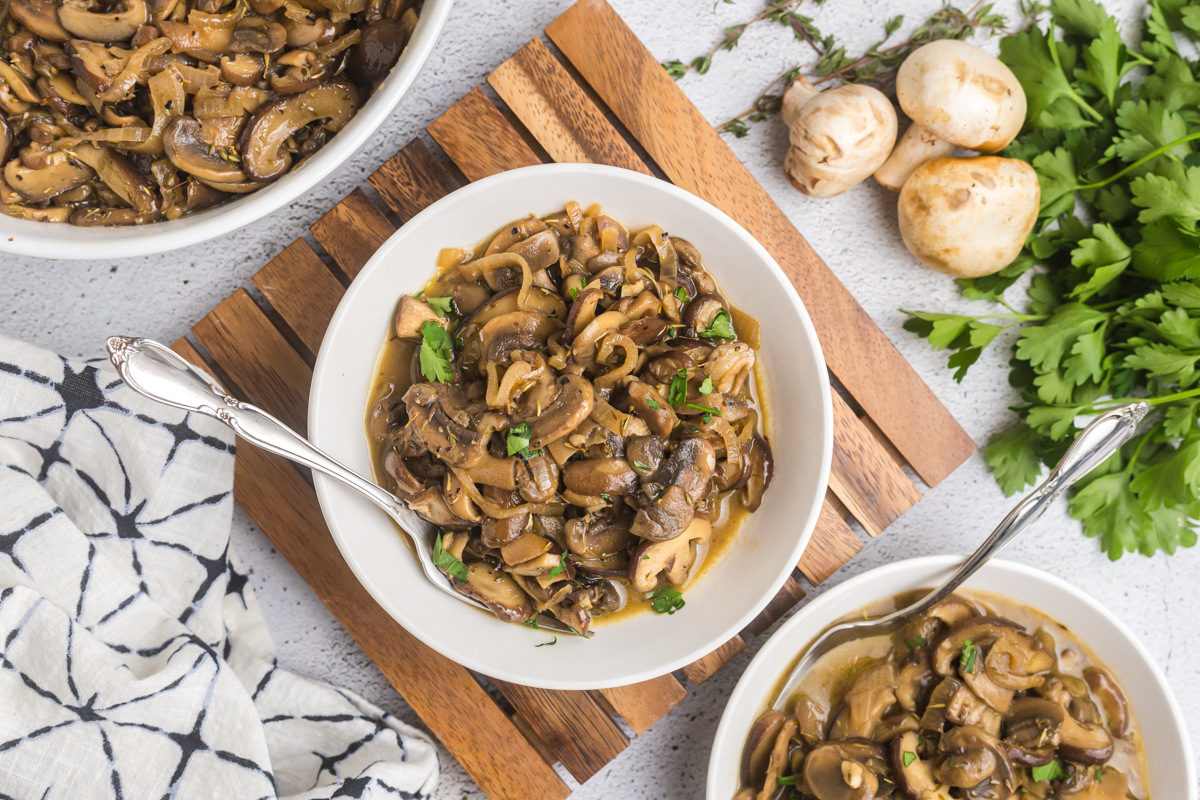 overhead shot of fork in bowl of mushrooms