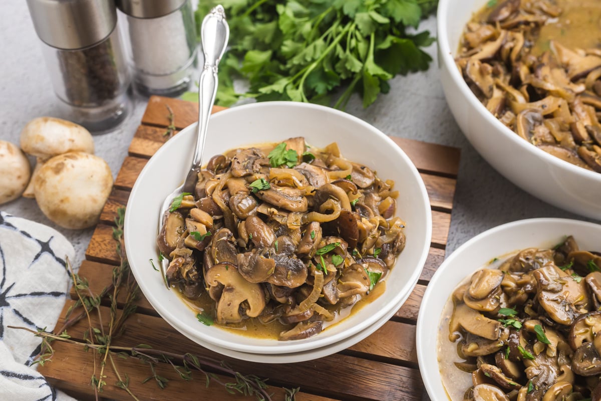 angled shot of fork in bowl of mushrooms