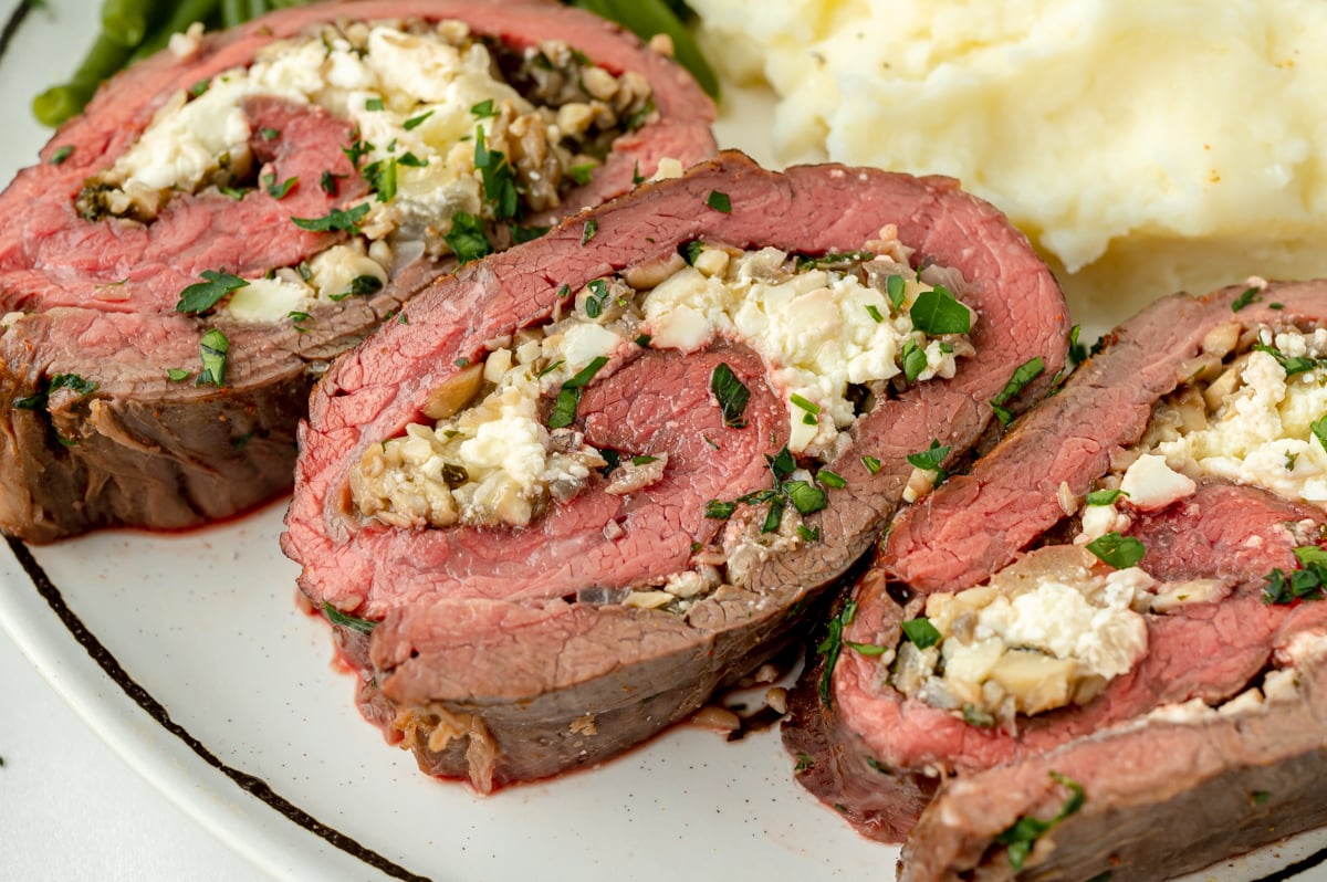 close up angled shot of sliced stuffed flank steak