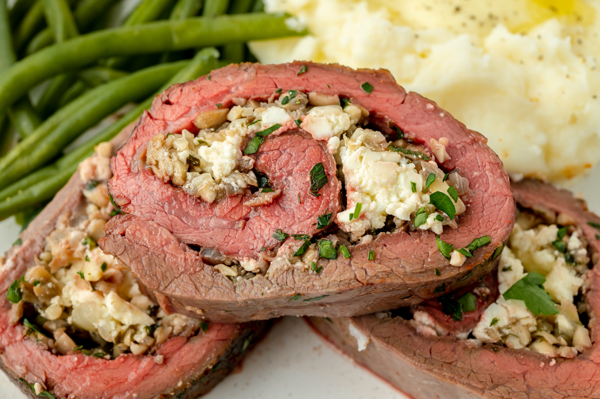 slices of stuffed flank steak on plate