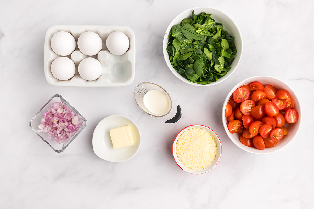 overhead shot of tomato spinach frittata ingredients