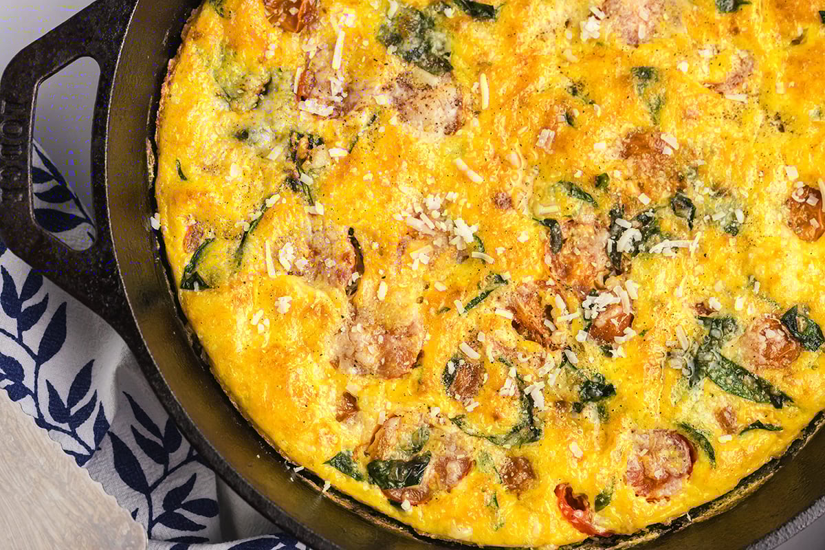 close up overhead shot of tomato spinach frittata
