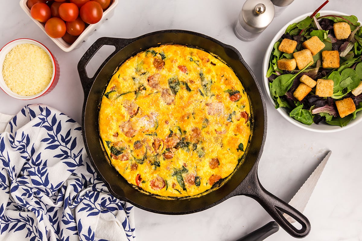 overhead shot of baked tomato spinach frittata