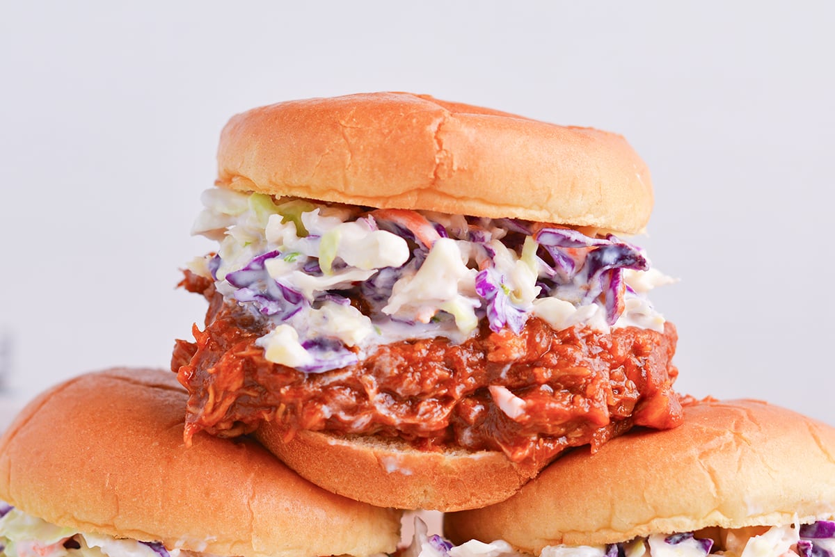 straight on shot of pulled pork sandwich with coleslaw