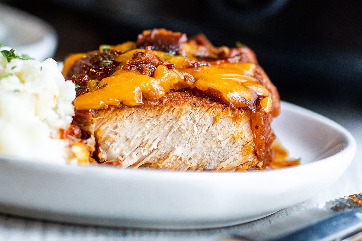 straight on shot of crock pot pork chop cut in half
