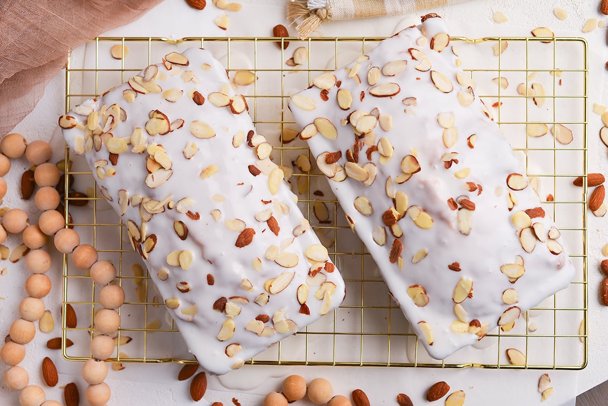 overhead shot of two almond pound cakes on cooling rack