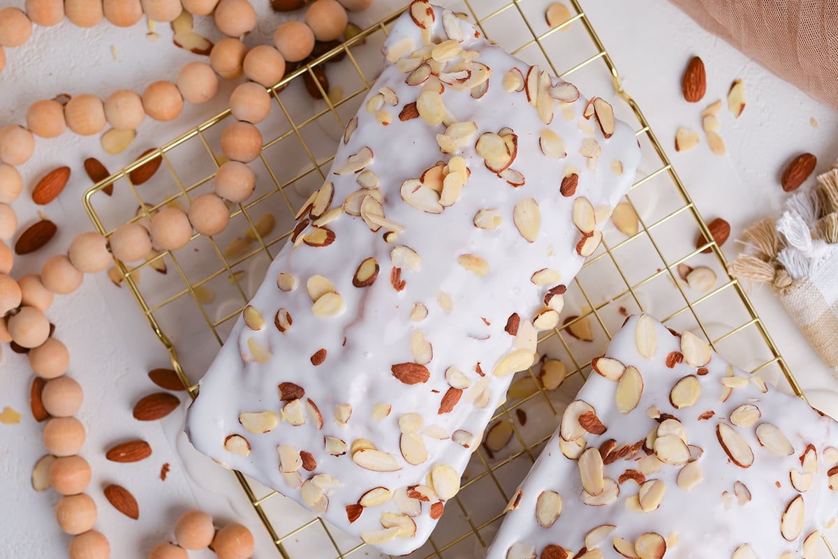 close up overhead shot of almond pound cake on cooling rack