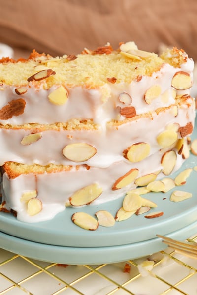 angled shot of three slices of almond pound cake on plate
