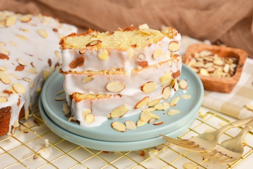 angled shot of three slices of almond pound cake on plate