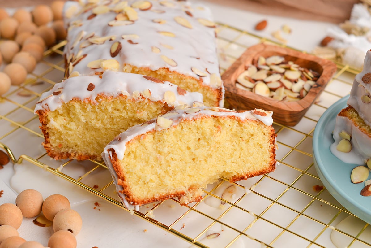 angled shot of sliced pound cake on cooling rack