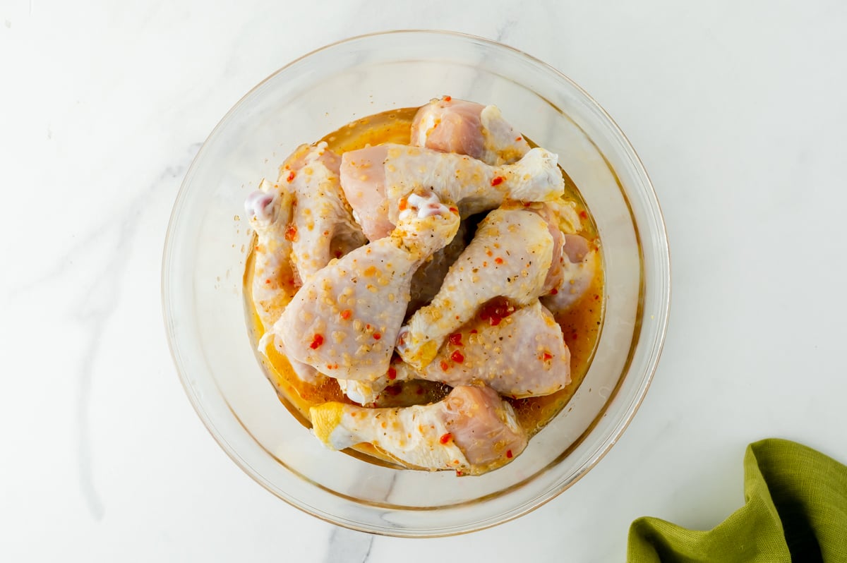 overhead shot of bowl of drumsticks marinating