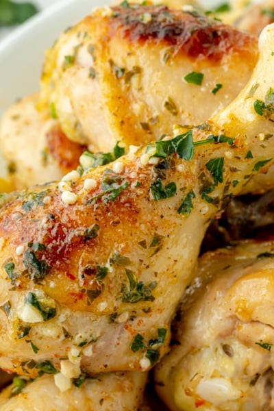 angled shot of platter of baked chicken drumsticks