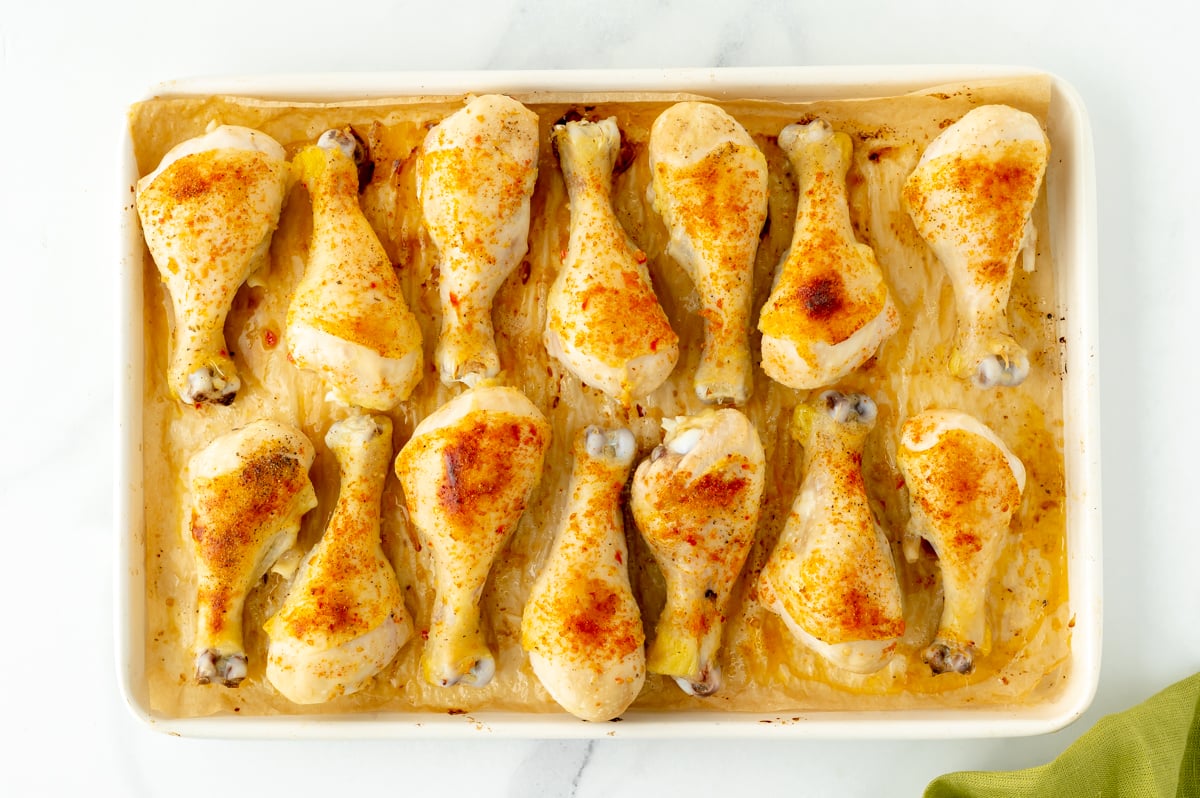 overhead shot of chicken drumsticks on sheet pan