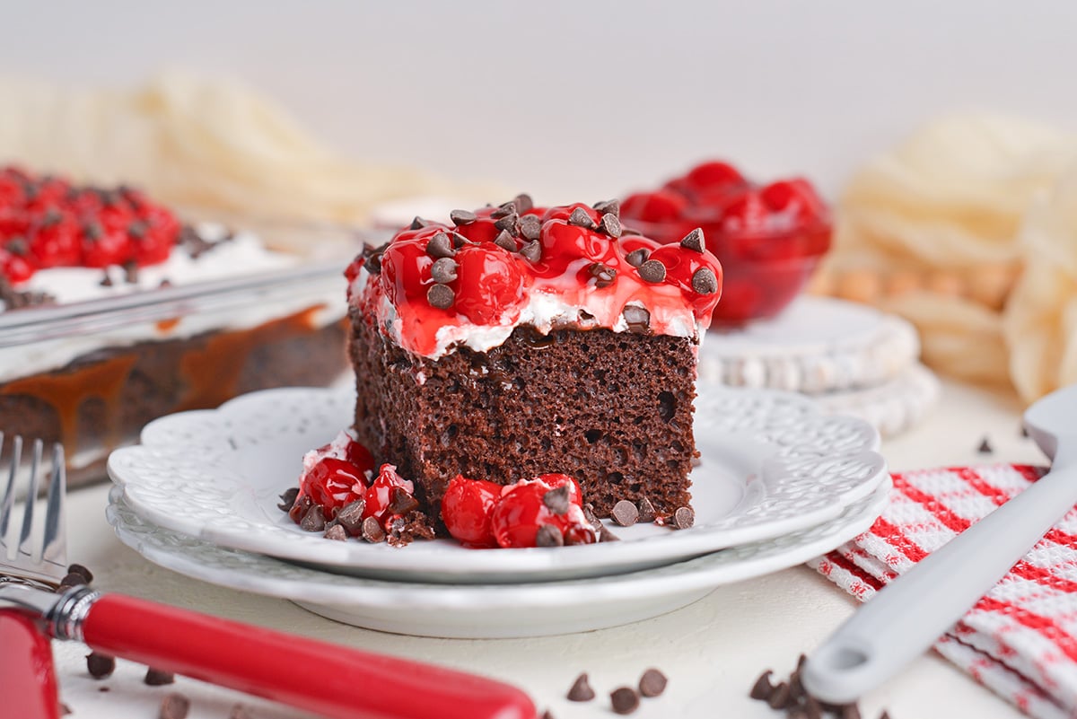 straight on shot of slice of black forest poke cake