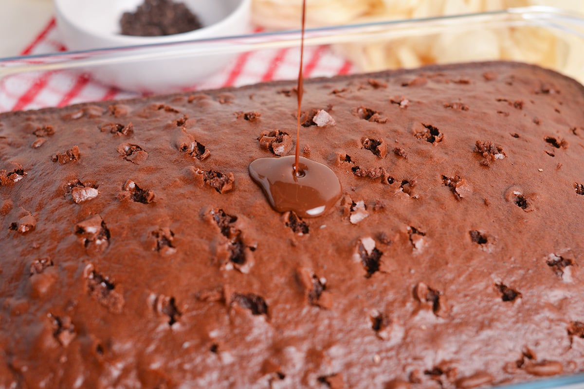 chocolate pudding pouring over chocolate cake