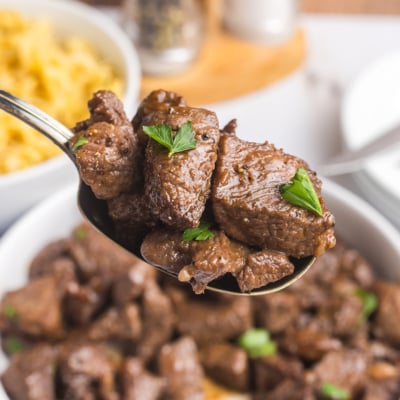 angled shot of brown sugar steak tips on spoon