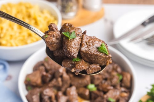 angled shot of brown sugar steak tips on spoon