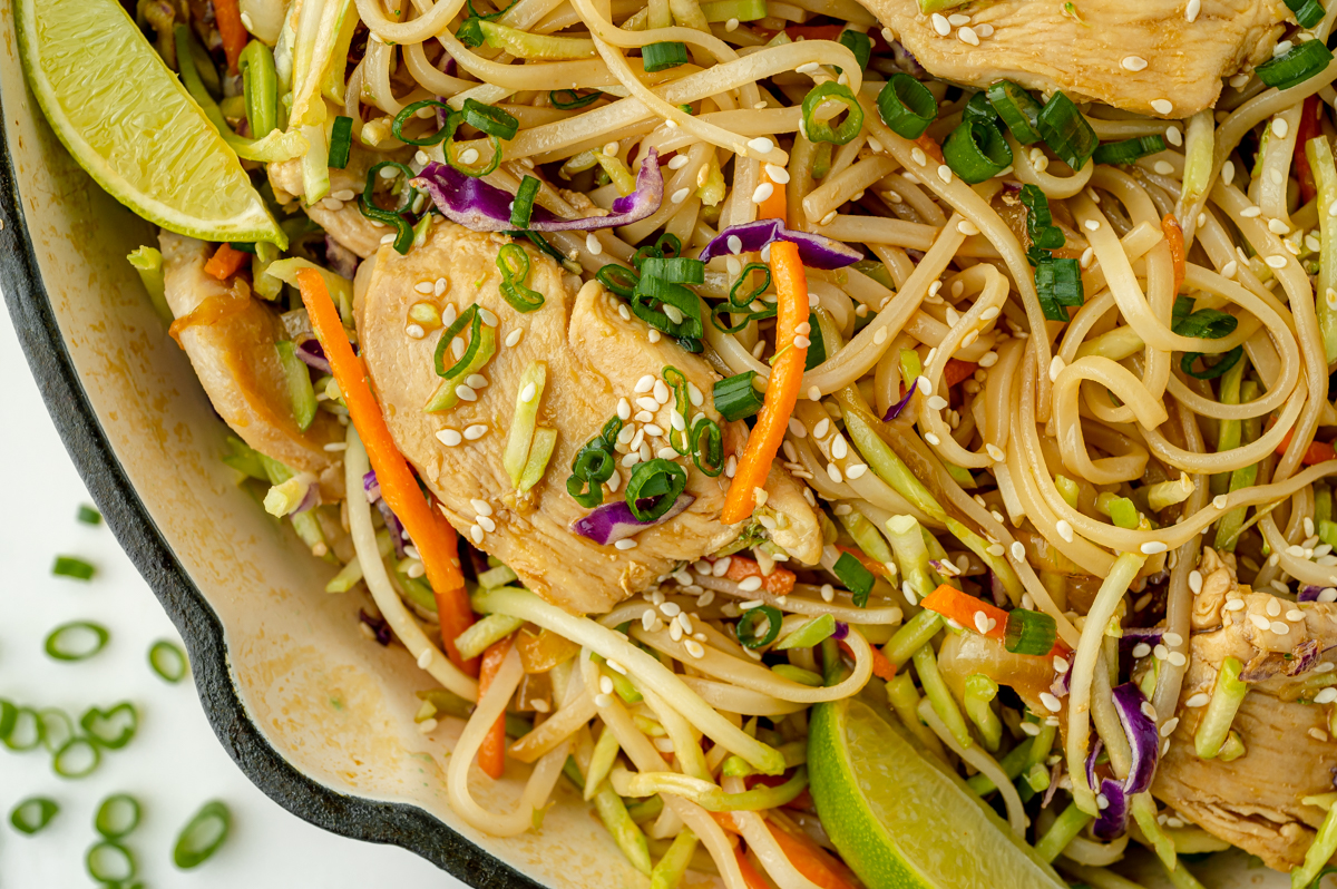 close up overhead shot of pan of chicken stir fry rice noodles