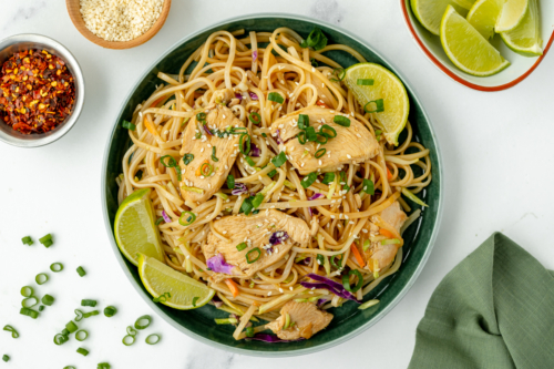 overhead shot of bowl of chicken stir fry rice noodles