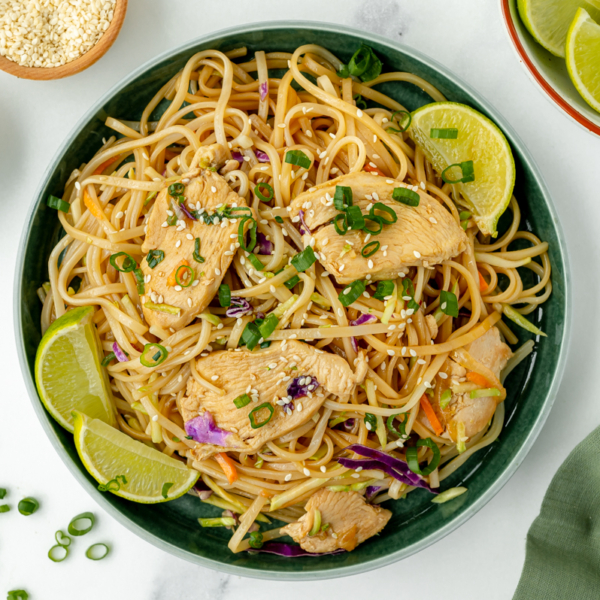 overhead shot of bowl of chicken stir fry rice noodles