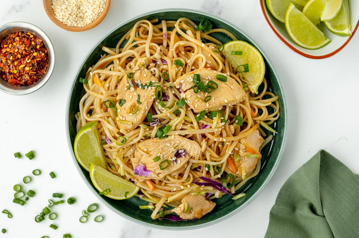 overhead shot of bowl of chicken stir fry rice noodles
