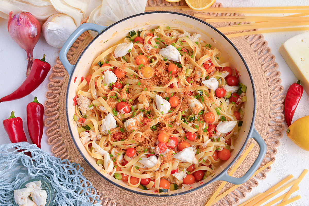 overhead shot of creamy chili crab pasta in pot