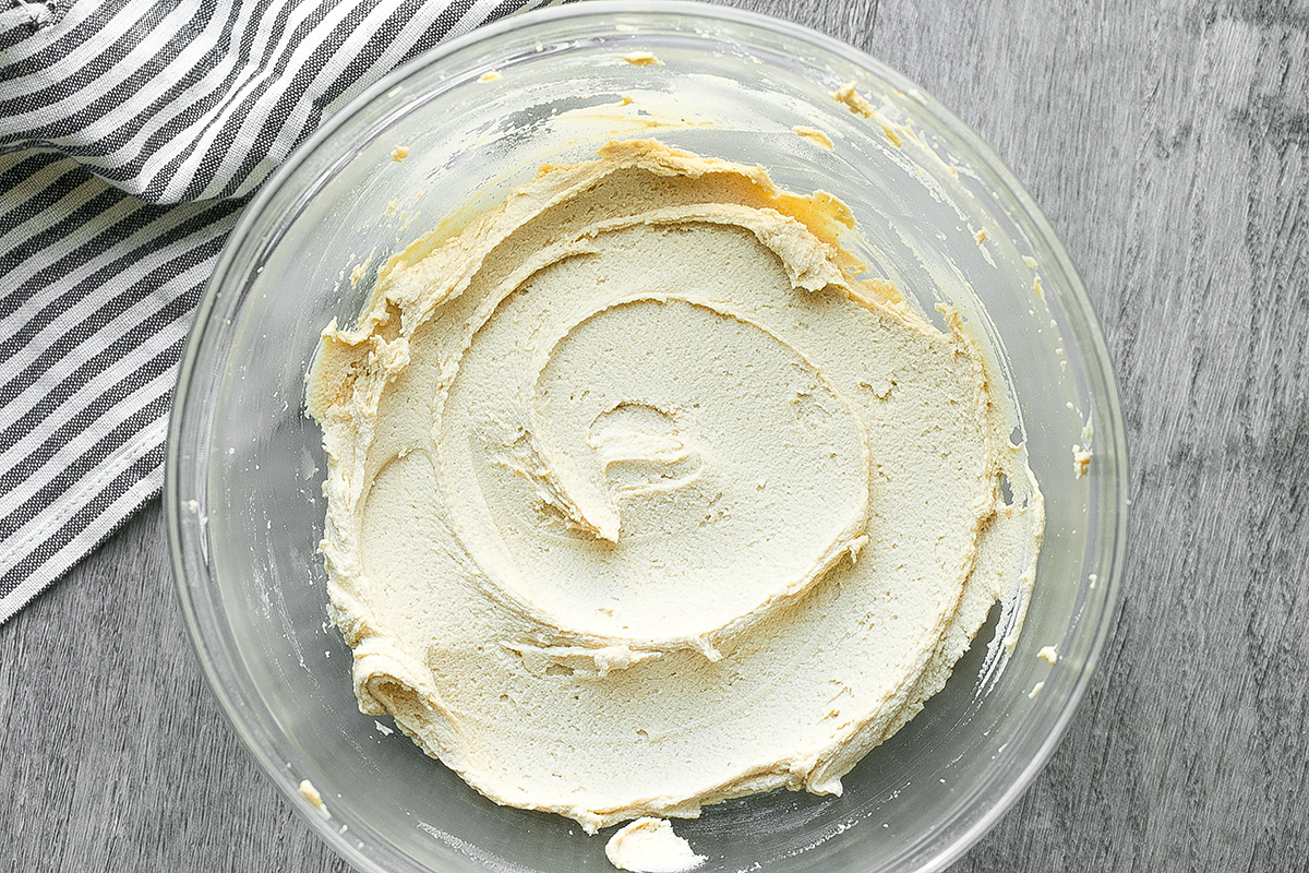 overhead shot of bowl of peanut butter frosting