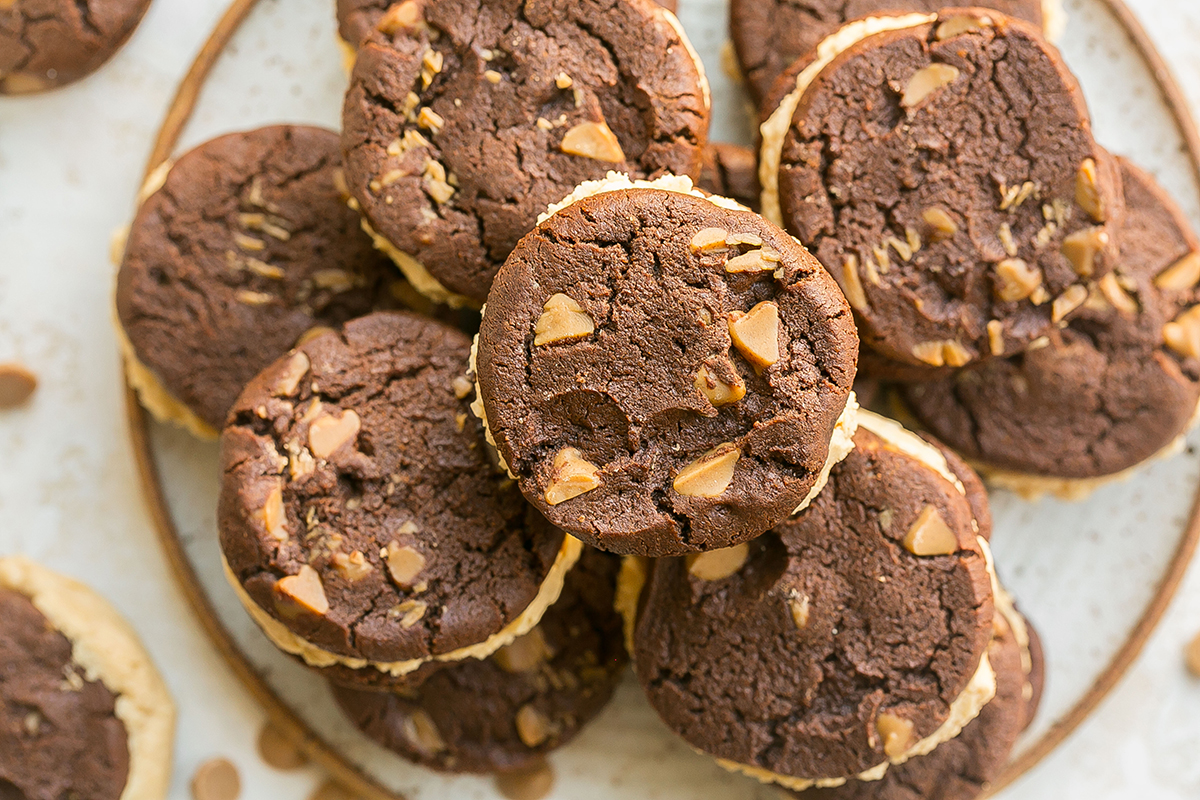 overhead shot of plate of chocolate peanut butter cookie sandwiches