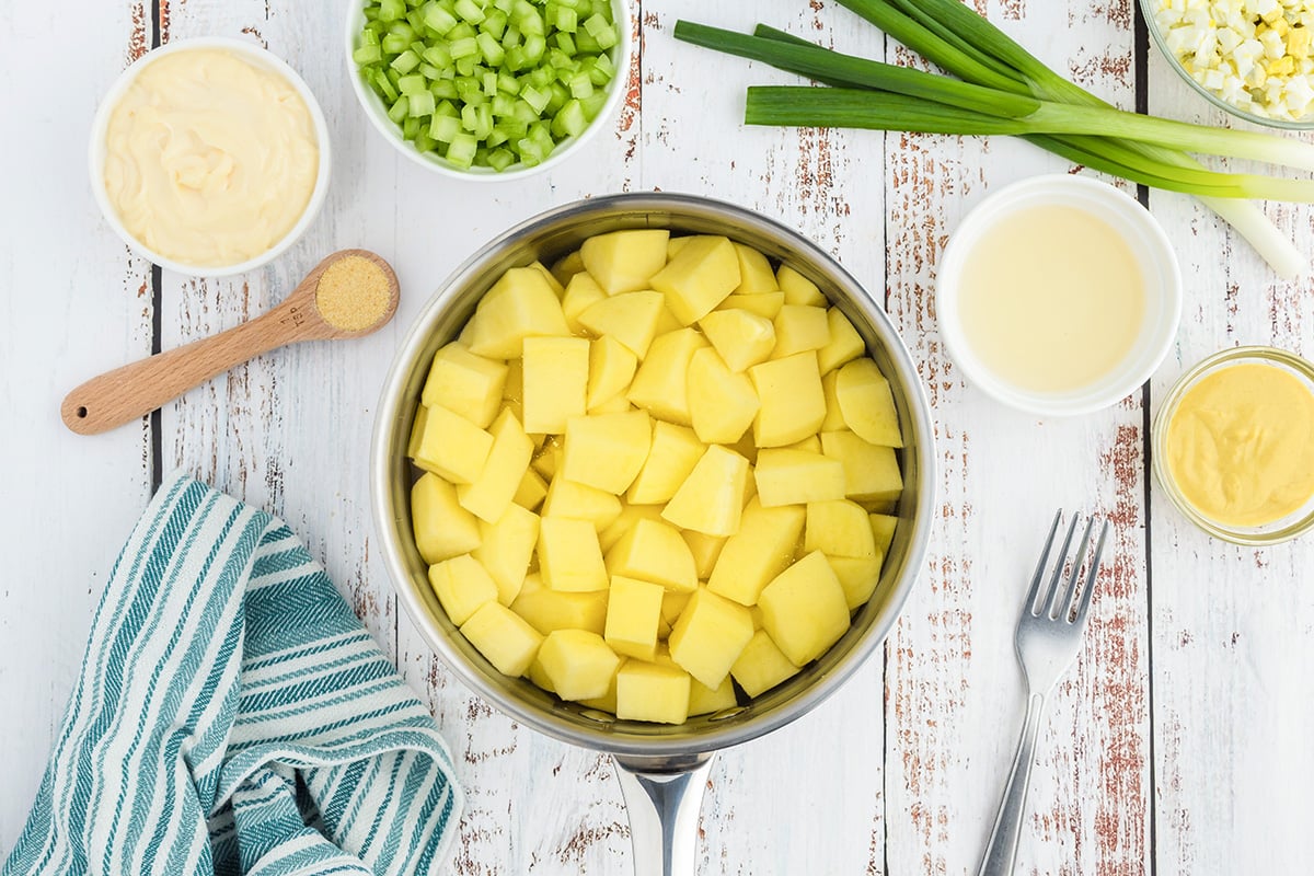 overhead shot of chopped potatoes in saucepan
