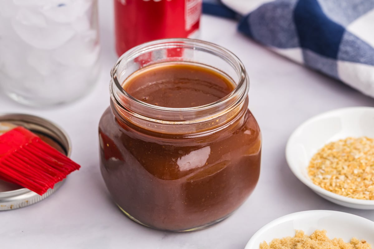 angled shot of jar of bbq sauce