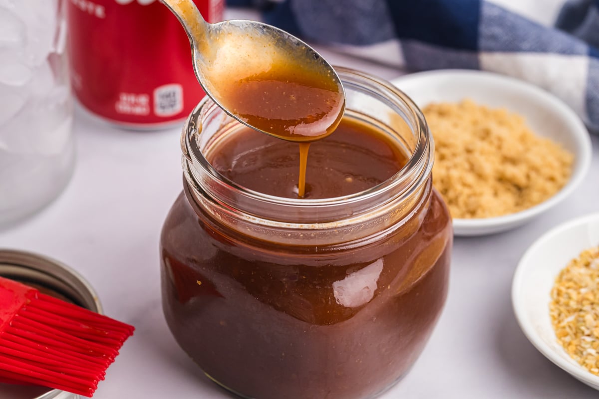 spoon in jar of cola bbq sauce