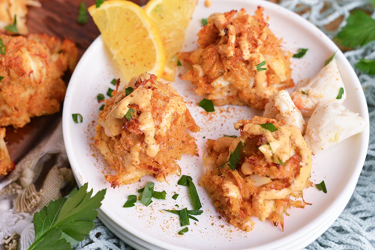 close up overhead shot of plate of three crab balls