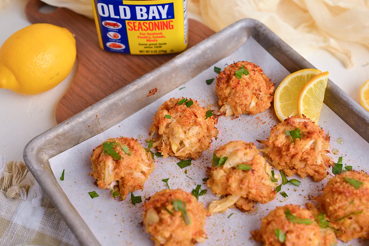 angled shot of crab balls on baking sheet