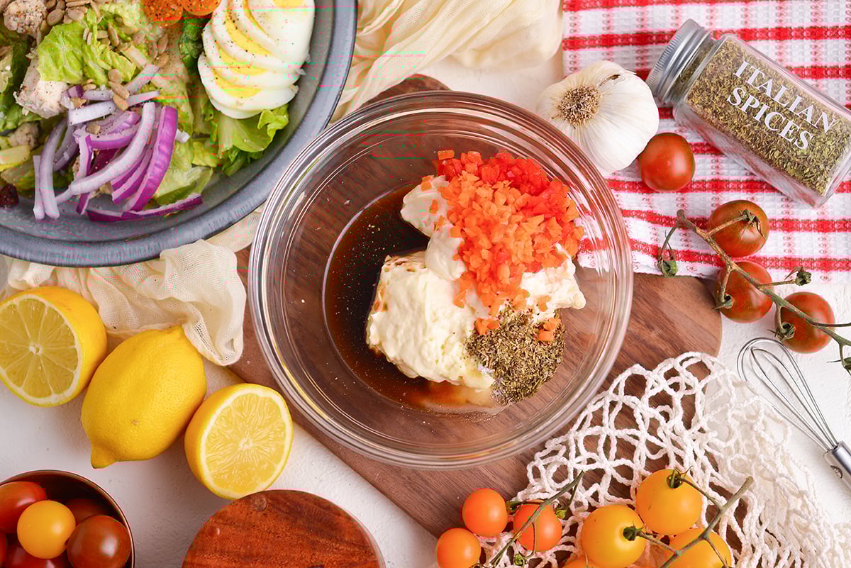 overhead shot of creamy italian dressing ingredients in bowl