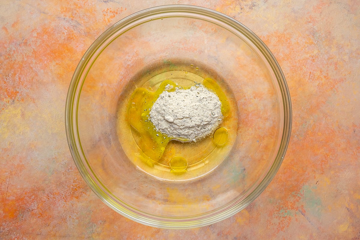ranch seasoning, pickle juice and oil in bowl