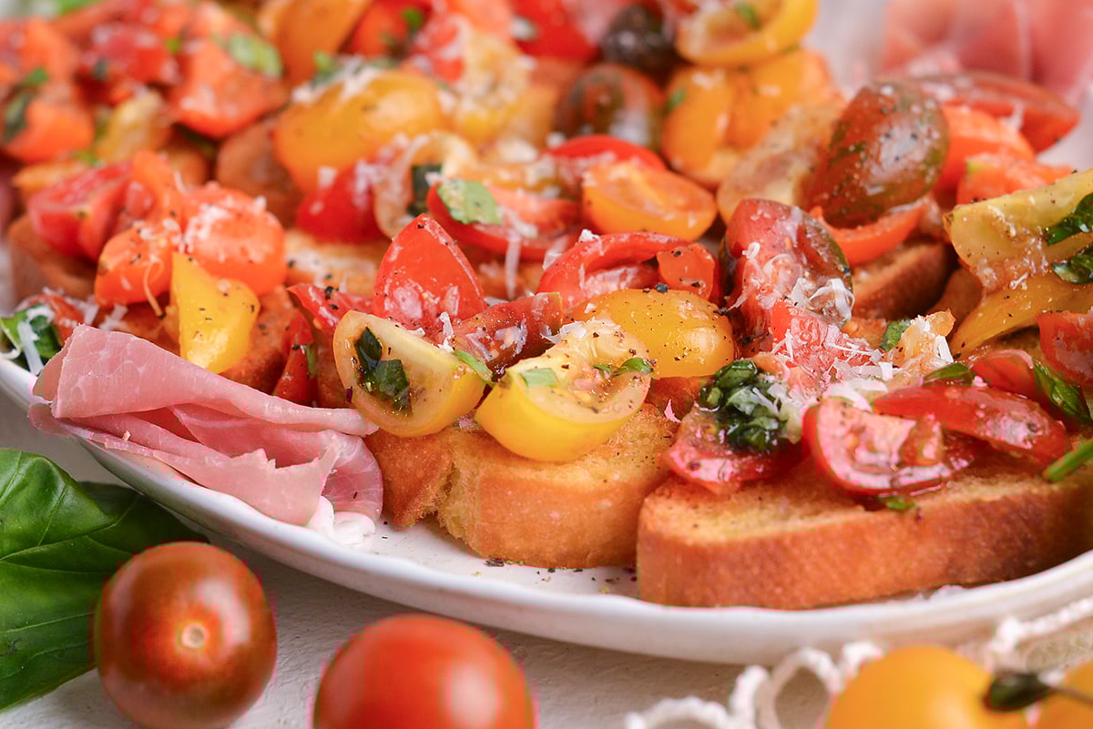 close up angled shot of platter of tomato bruschetta