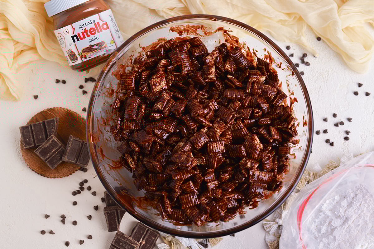 overhead shot of bowl of chex coated in chocolate