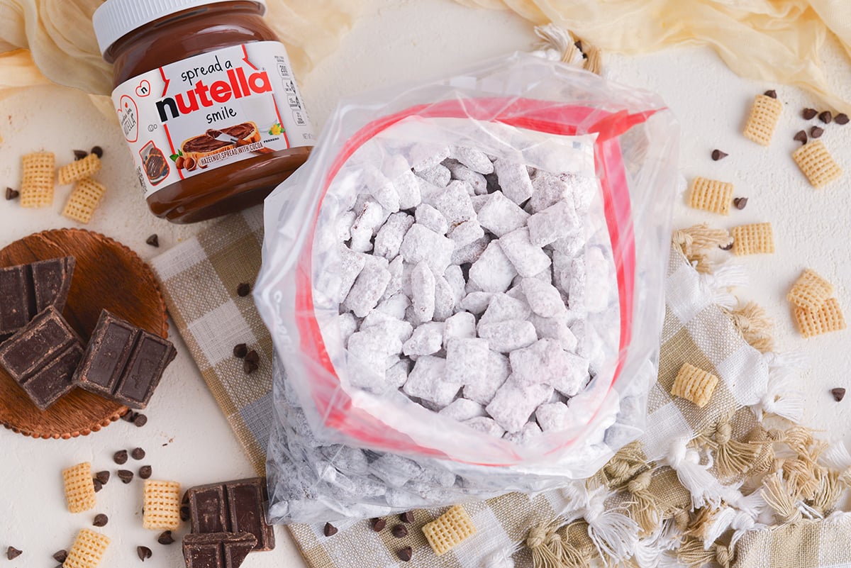 overhead shot of nutella puppy chow in ziplock bag