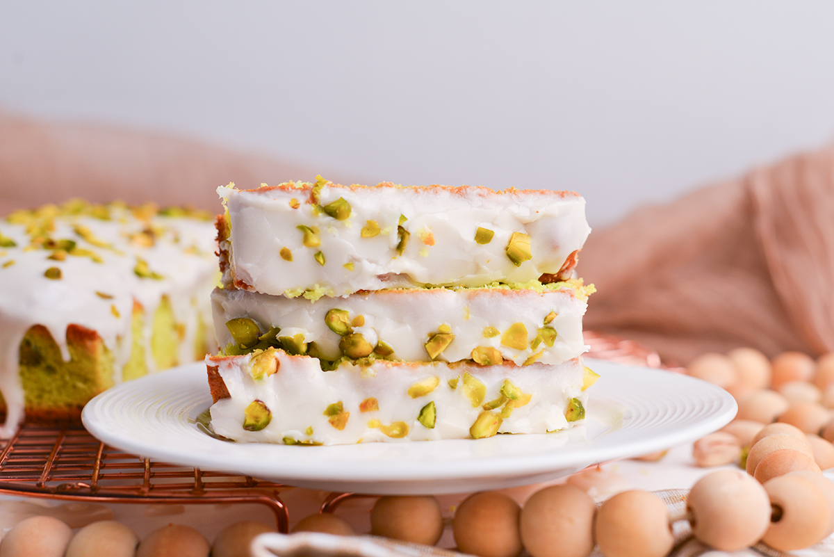 straight on shot of three slices of pistachio bread on plate