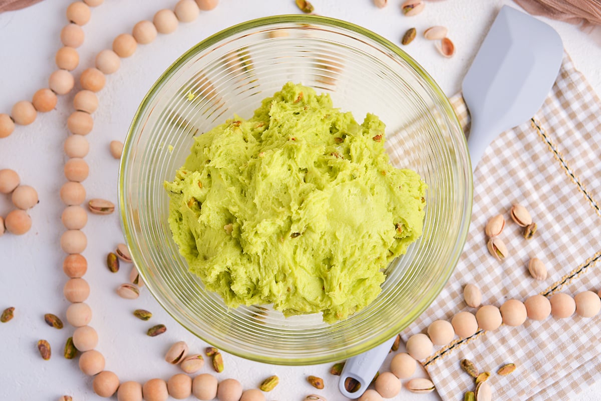 overhead shot of green cake batter in bowl