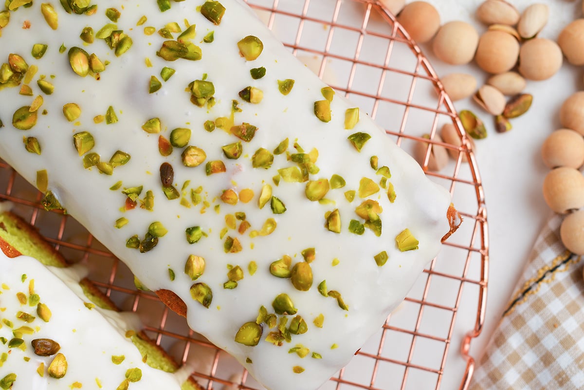 overhead shot of chopped pistachios on cake